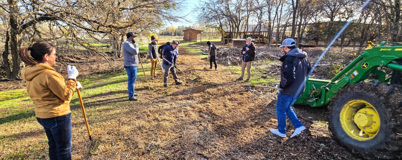 Group of people working on a dirt road