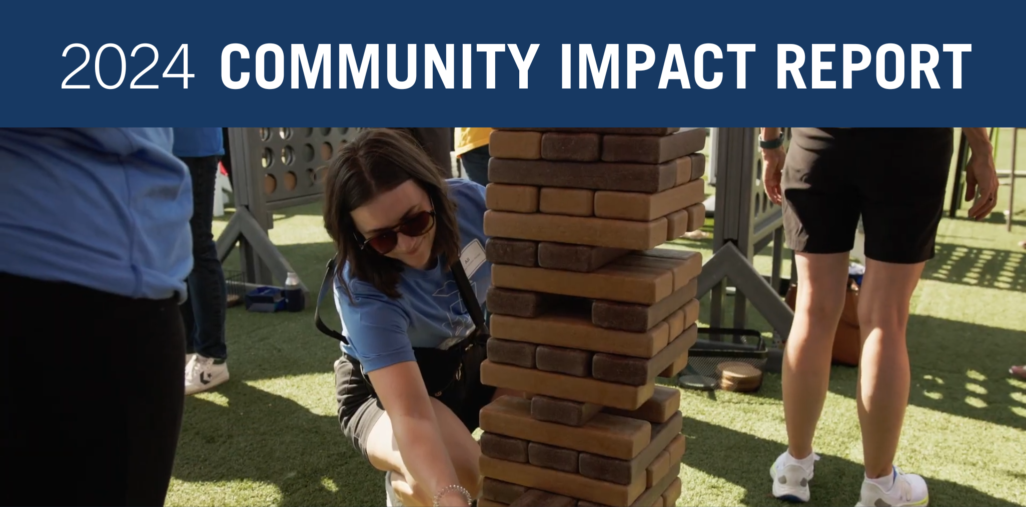 2024 Community Impact Report, woman playing a giant jenga set, Enterprise Games KC