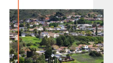 aerial view of homes in a community on a hill