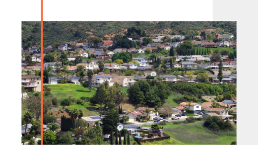 aerial view of homes in a community on a hill
