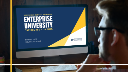 Man looking at computer screen. Titles: Enterprise University, Better your Business Knowledge one course at a time