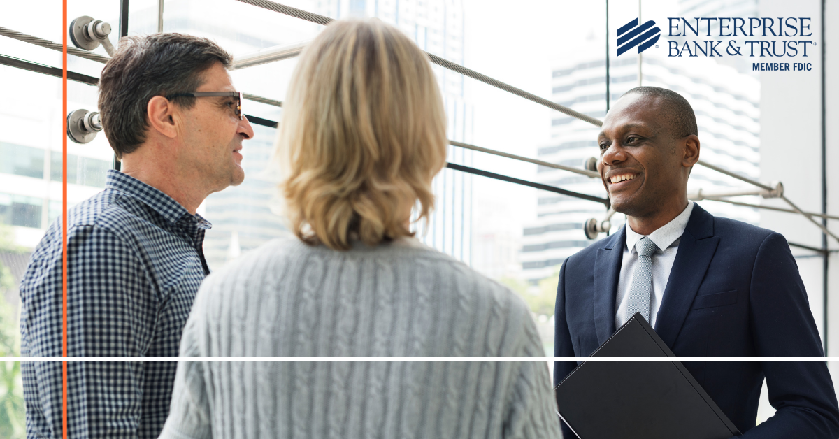 Couple having a conversation with a businessman