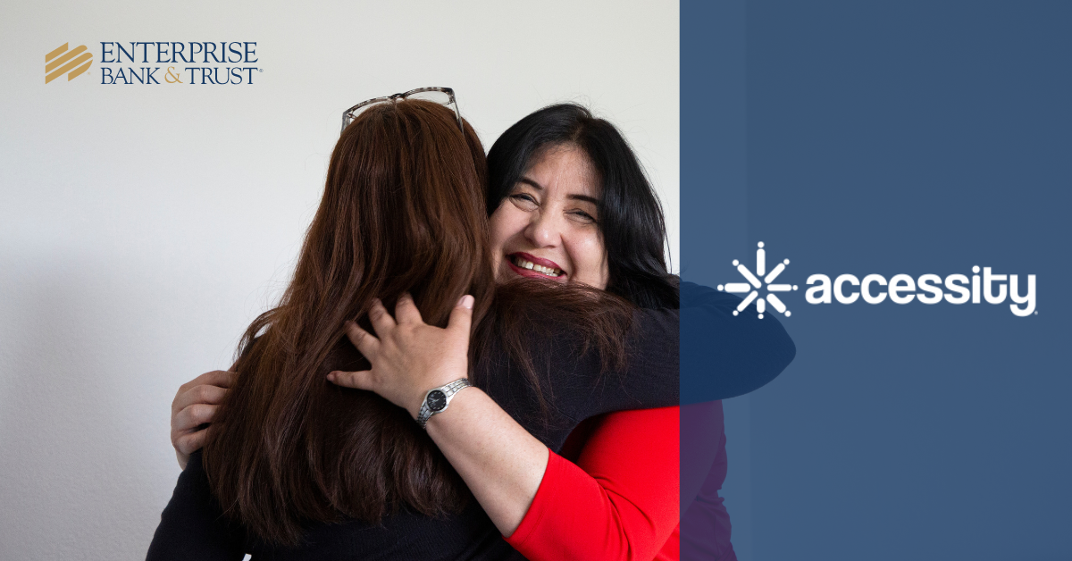 Two women hugging and the Accessity Logo