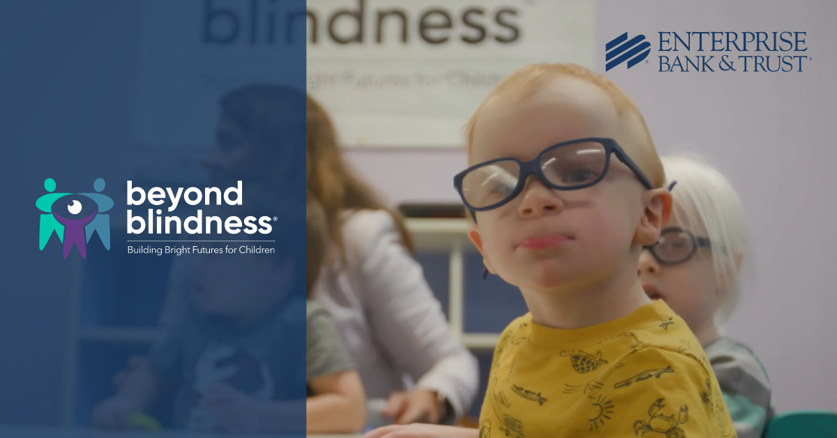 Beyond Blindness Logo and a child with glasses on