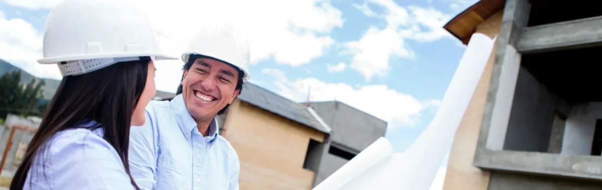 Hispanic couple with house plans
