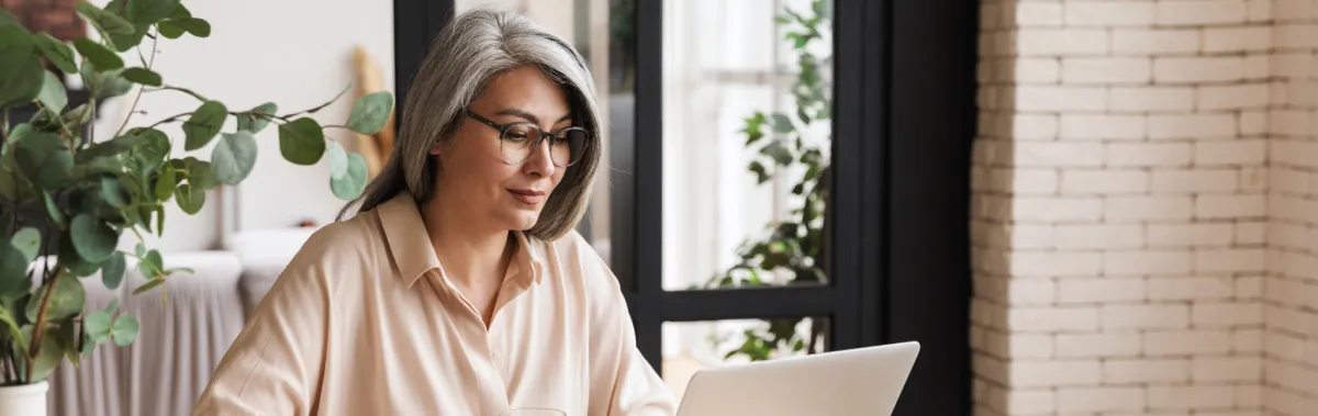 Woman working on laptop, digital banking