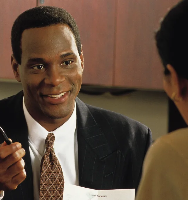 Banker speaking with customers