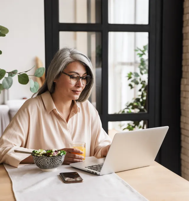Woman working on a laptop, digital banking