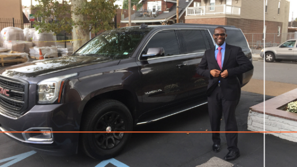 Man standing in front of a large SUV