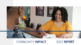 community impact 2022 report, woman smiling while talking with a man behind a counter