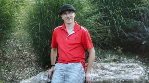 man sitting on a rock