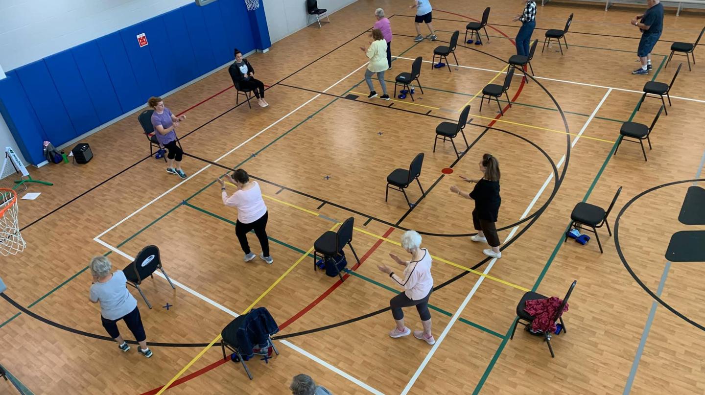 Atchison YMCA older adult fitness class in gym