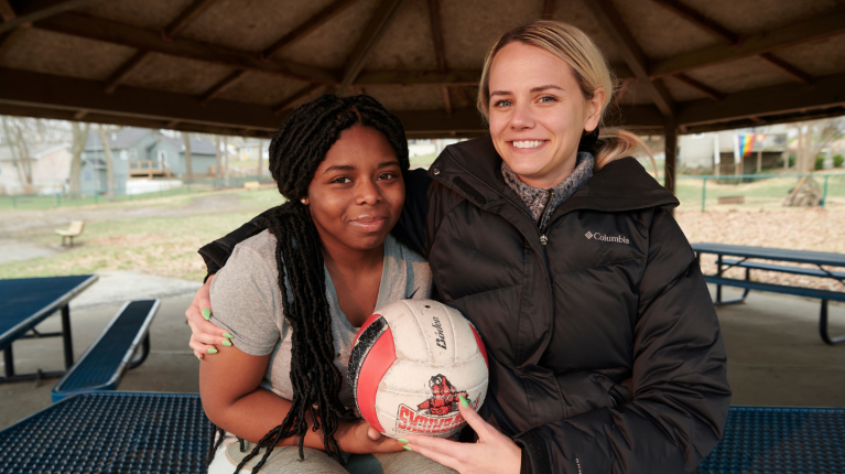 two young women with volleyball