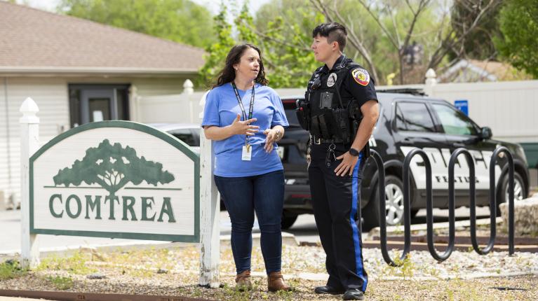 Comtrea employee speaking with a police officer